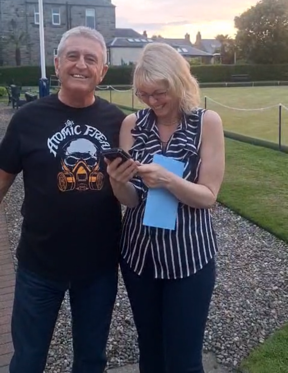 Freak Family members in an ATOMIC FREAK tee at sunset