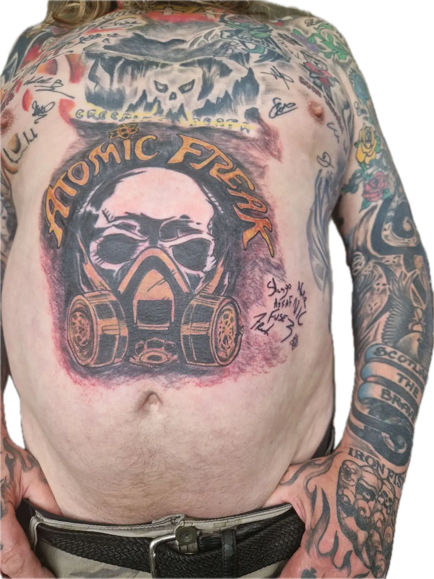 Fan with a large ATOMIC FREAK gas mask tattoo