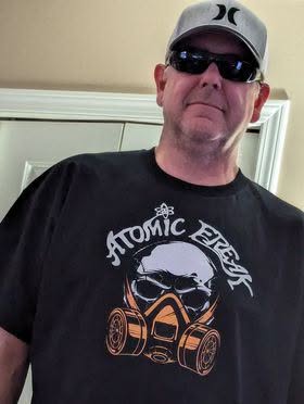 Freak Family member in a black ATOMIC FREAK skull tee