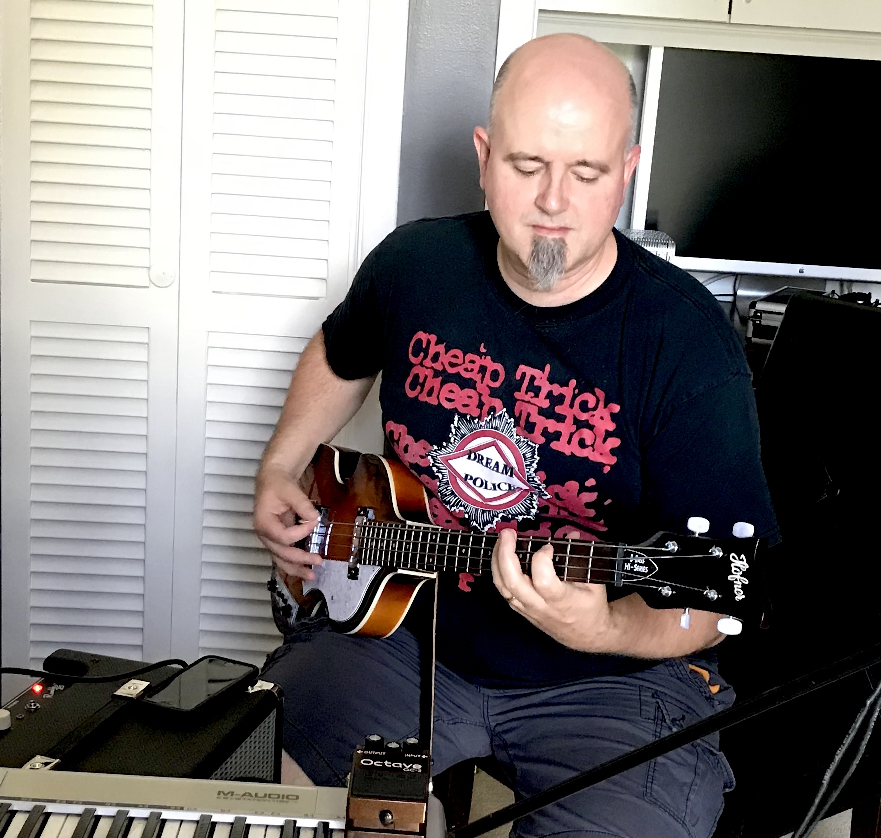 Fan playing a Hofner bass at home