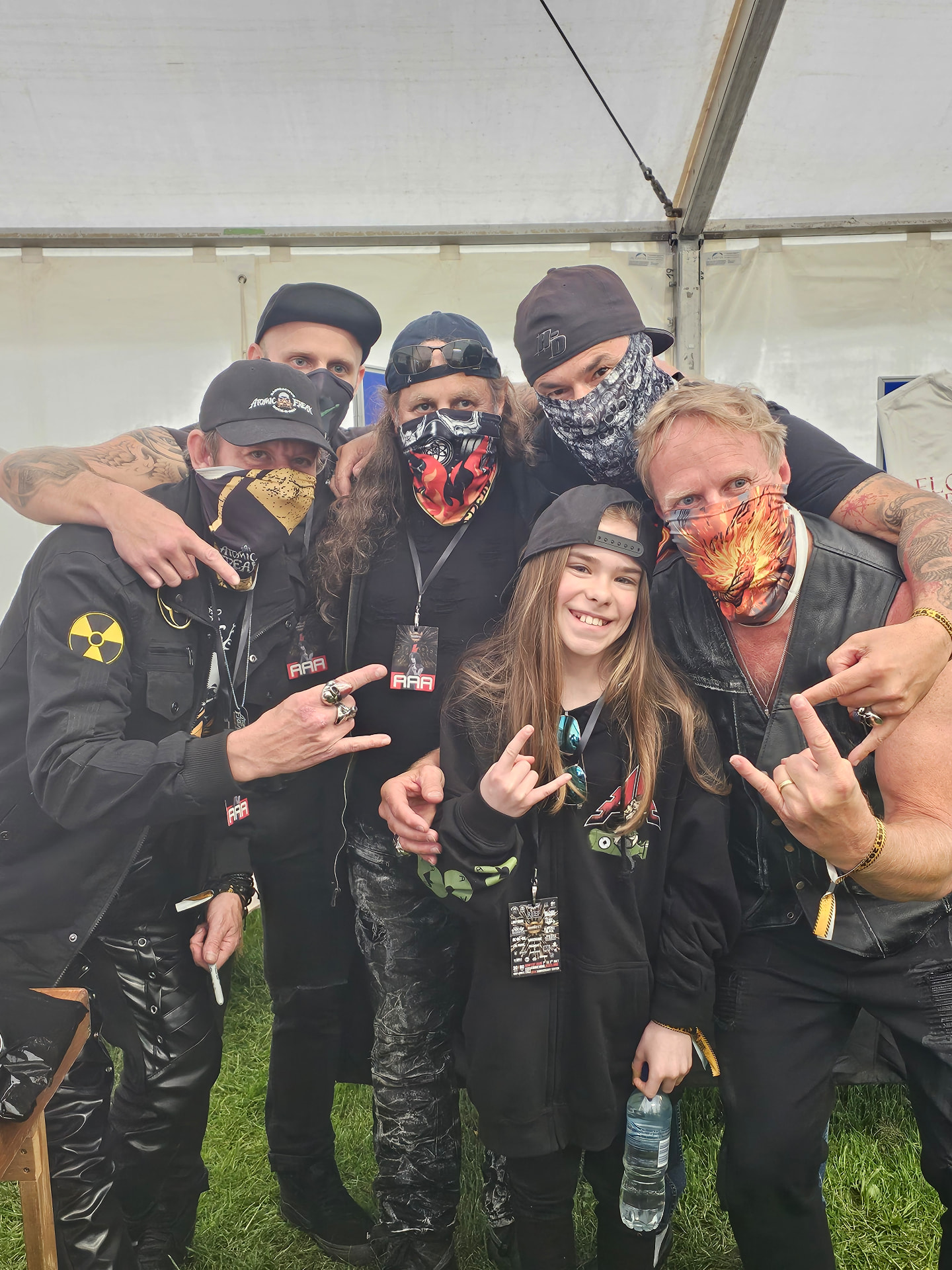 Freak Family members and a young fan at a festival
