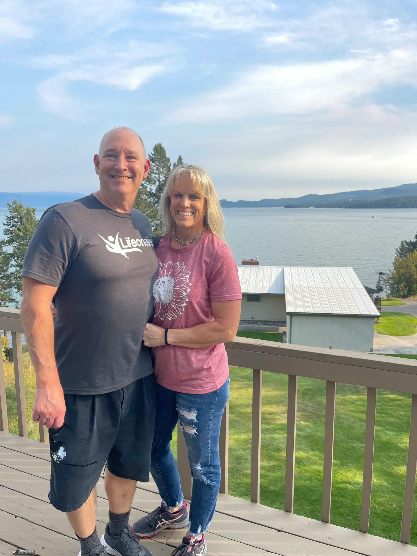Two fans on a lakeside deck