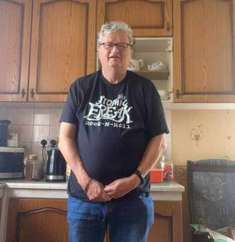 Freak Family member wearing an ATOMIC FREAK Rock-N-Roll tee
